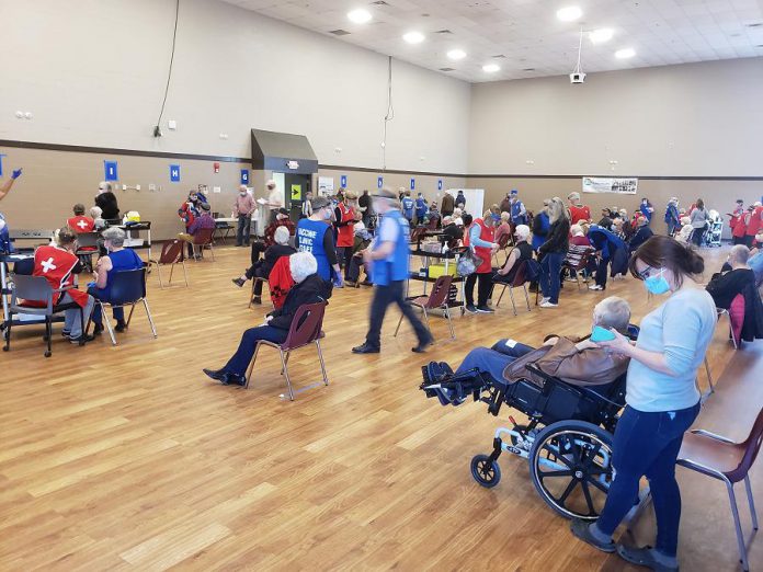 Residents 80 years of age and older receiving their first doses of the Pfizer vaccine at the COVID-19 immunization clinic at Evinrude Centre in Peterborough on March 21, 2021. (Photo: Jeannine Taylor / kawarthaNOW)