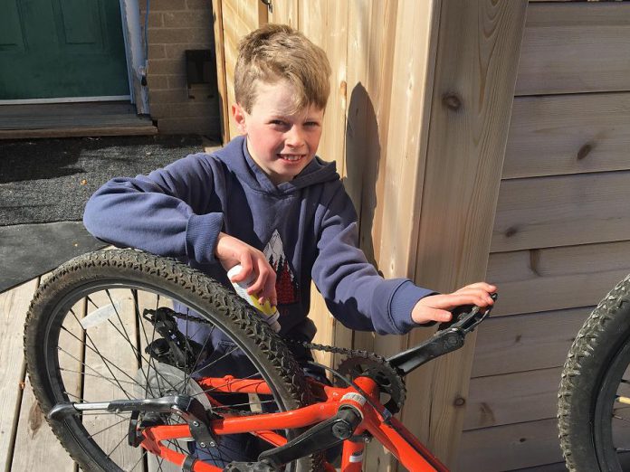 Kye is getting his bike ready for spring, making sure his chain is well oiled and free of damage. Once it's ready, he'll plan his cycling route with his family. Together, they'll make sure it is fun and free of hazards. (Photo: Jackie Donaldson)