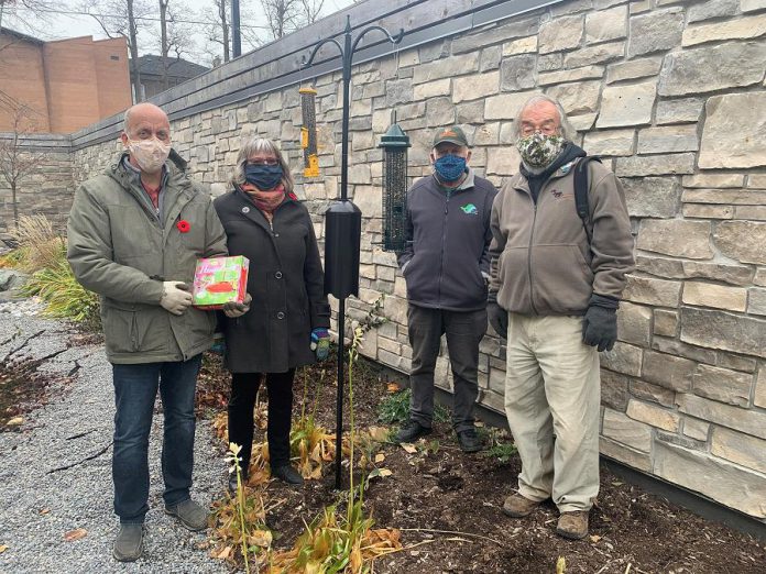 Clayton and Brenda Ibey of The Avant-Garden Shop with King Baker and and Martin Parker of the Peterborough Field Naturalists after installing bird feeders installed at Hospice Peterborough in fall 2020. (Photo courtesy of Hospice Peterborough)