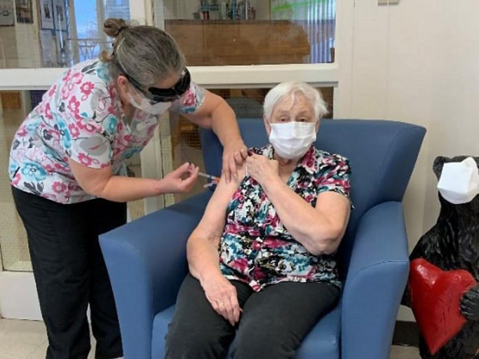 Lorraine Button, a resident of Pinecrest Nursing Home in Bobcaygeon, received her first dose of the Moderna COVID-19 vaccine on January 27, 2021. As of March 3, around 1,700 residents of long-term care homes in Kawartha Lakes, Northumberland, and Haliburton are fully vaccinated against COVID-19. (Photo: Haliburton, Kawartha, Pine Ridge District Health Unit / Facebook)