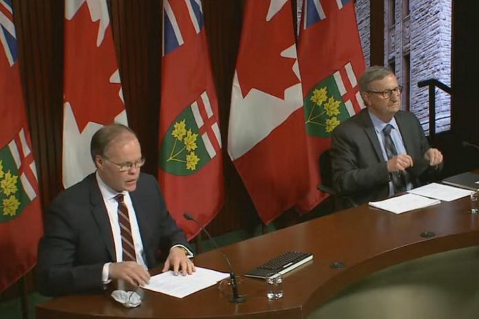 Adalsteinn Brown, co-chair of the Ontario COVID-19 Science Advisory Table, and Dr. David Williams, Ontario's chief medical officer of health, present updated COVID-19 modelling projections at a media briefing on April 16, 2021. (CPAC screenshot)