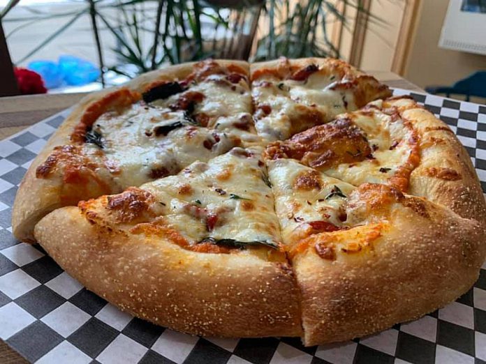 Pastry Peddler has been trying different things to keep customers engaged throughout the pandemic, including selling delicious gourmet takeout pizzas every Friday, such as this sundried tomato, roasted red pepper and basil pizza on a homemade crust. (Photo courtesy of Pastry Peddler)