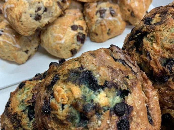 The Pastry Peddler's blueberry and white chocolate muffins, with trail mix scones in the background.  (Photo courtesy of Pastry Peddler)