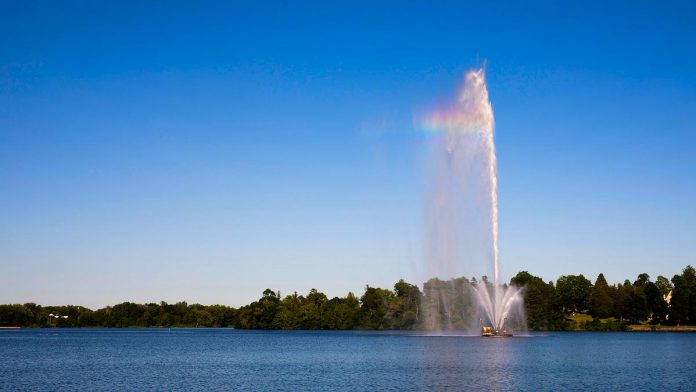 The Centennial Fountain in Peterborough's Little Lake, pictured in July 2018, will turn on for the 2021 season on May 26 and run until October 11. (Photo: City of Peterborough)