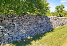 An intact section of the historic Edgewood dry stone wall in Bobcaygeon. A group of Bobcaygeon volunteers are raising funds to restore the 400-foot wall, built in 1891, for its 130th anniversary in 2021. (Photo: Heritage Evaluation Report, September 2020)