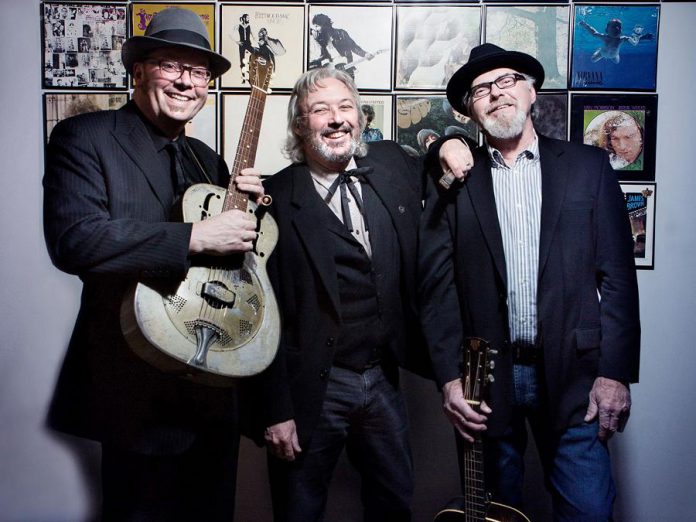 Rick Fines, Al Black, and Gary Peeples of Jackson Delta pictured in 2019. The Peterborough acoustic blues trio will be headlining a PTBOLive drive-in concert at the Peterborough Memorial Centre on August 27, 2021, with Peterborough blues-rock band Emily Burgess & The Emburys opening. (Photo courtesy of SLAB Production)