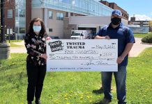 Jon Perrin presents a cheque for $2,500 to the Ross Memorial Hospital Foundation in Lindsay. Perrin, an OPP officer who suffers from PTSD, has become an advocate for mental health awareness. (Photo courtesy of Ross Memorial Hospital Foundation)