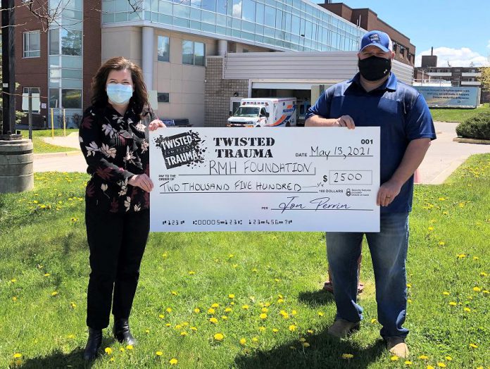 Jon Perrin presents a cheque for $2,500 to the Ross Memorial Hospital Foundation in Lindsay. Perrin, an OPP officer who suffers from PTSD, has become an advocate for mental health awareness. (Photo courtesy of Ross Memorial Hospital Foundation)