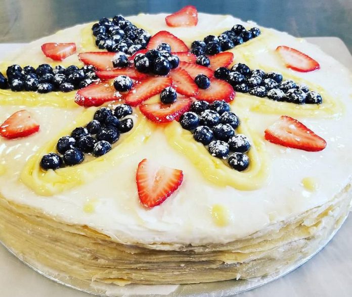 The Crepes of Wrath's crepe mille feuille cake features 20 crepes layered with mascarpone and lemon curd and topped with fresh berries. It measures a full 16" diameter and is 4" high. (Photo: Crepes of Wrath)