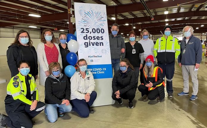 The staff at Ross Memorial Hospital's COVID-19 vaccination clinic at the Lindsay Exhibition celebrates the 25,000th dose administered at the clinic on May 28, 2021. (Photo courtesy of Ross Memorial Hospital)