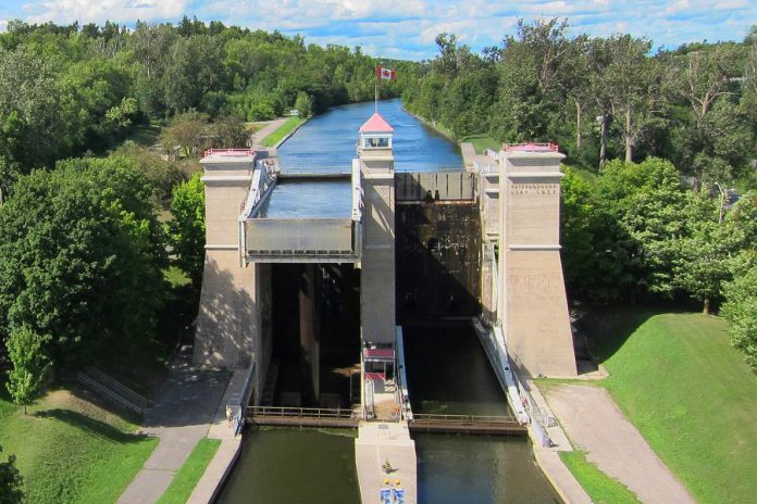 The Peterborough Lift Lock pictured in the early 2000s, before vegetation was removed from along the earth berm on the northeast approach to the Lift Lock as the roots of trees and large shrubs were creating subsurface instability. (Photo: Parks Canada)