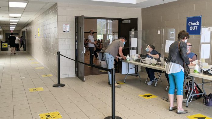 People leave the Evinrude Centre in Peterborough on May 26, 2021, after receiving their first dose of the Pfizer vaccine. Under the province's accelerated schedule for second doses, they will be eligible to receive their second dose during the first week of August. (Photo: Bruce Head / kawarthaNOW)