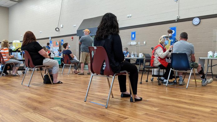 A few of the 9,000 people in the Peterborough region who received their first dose of COVID-19 vaccine in the past week, at the mass vaccination clinic at Evinrude Centre on May 26, 2021. (Photo: Bruce Head / kawarthaNOW)