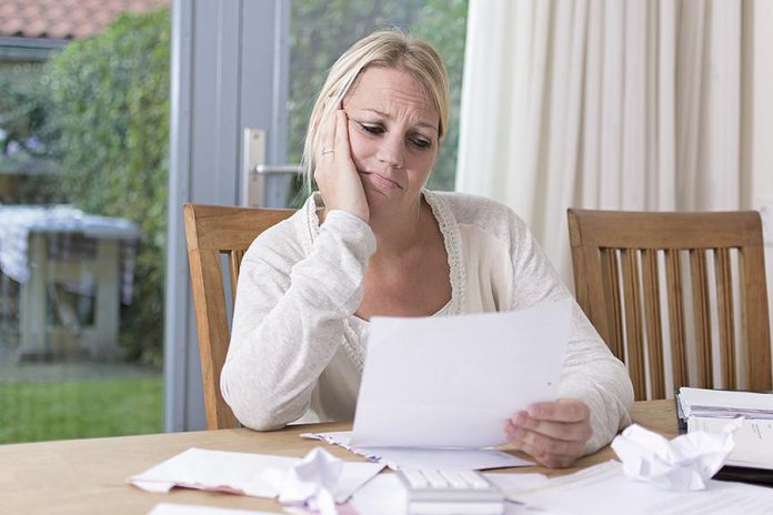 A woman with financial problems. (Stock photo)