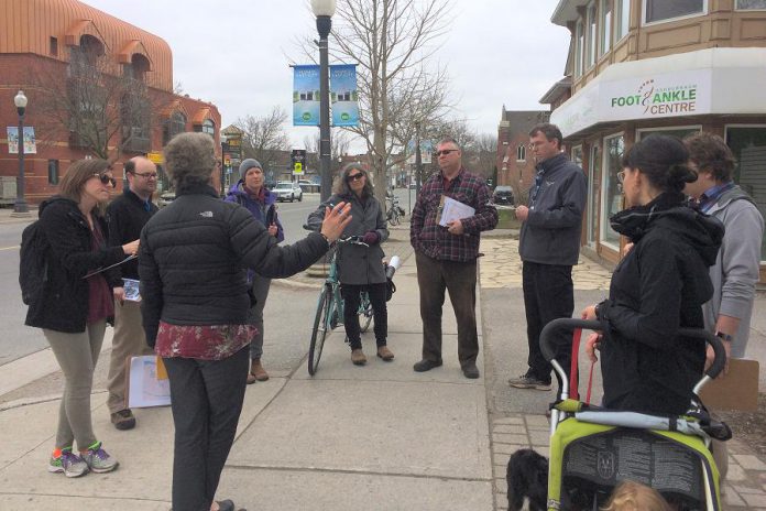It's better for students' health and the environment if they have active transportation options when they head back for in-person learning in the fall. Pictured are parents, guardians, teachers, school staff, and other community members in May 2019 during a walkabout of the Immaculate Conception School area in Peterborough's East City, an important opportunity to hear directly from community experts about active school travel challenges and opportunities. (Photo courtesy of GreenUP)
