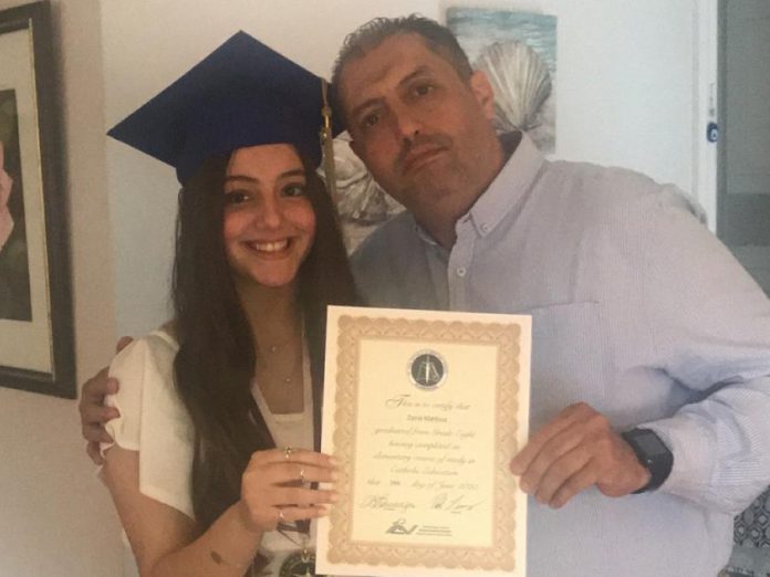 Imad Mahfouz with his daughter Zeina after she graduated from Grade 8. (Photo courtesy of the Mahfouz family)
