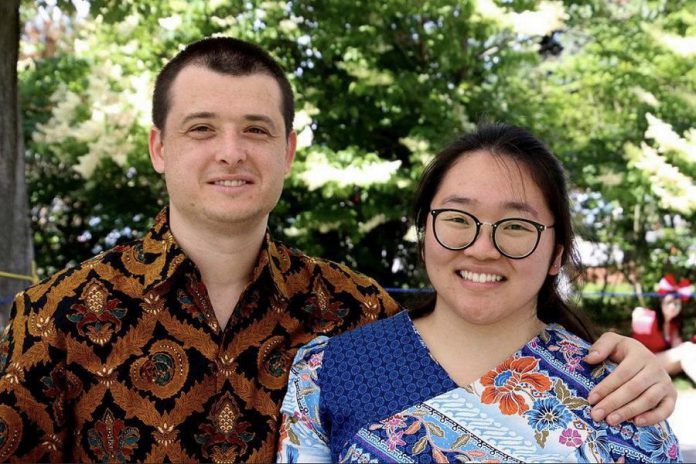 Jessie Iriwanto (right), originally from Indonesia, with her husband Dmitry, originally from Russia, who she met at Trent University when they were both international students. The couple, who married in 2014, turned to cooking as a hobby during the pandemic, with the goal of cooking a new dish from a different country once a month. Jessie is sharing her recipe for beef rendang, a signature dish from Indonesia, which she has adapted to accommodate ingredients commonly found in Canada. (Photo: Linda Cardona)