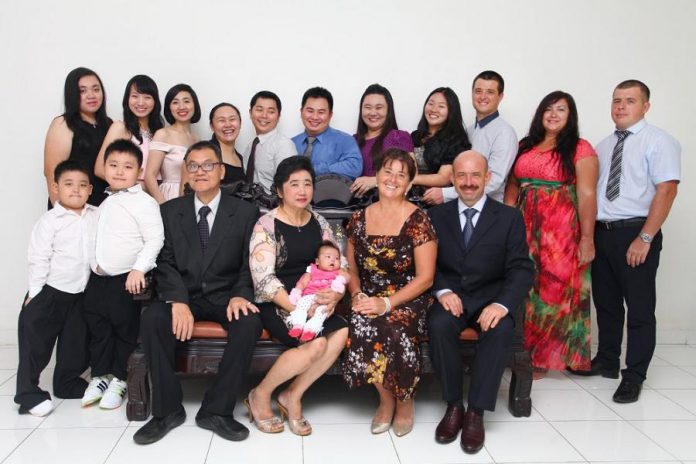 Jessie and her husband Dmitry are truly an international Canadian couple, as shown in this pre-pandemic photo of their families. Jessie's family live in Indonesia and Dmitry's family lives in Russia. (Photo courtesy of Jessie Iriwanto)