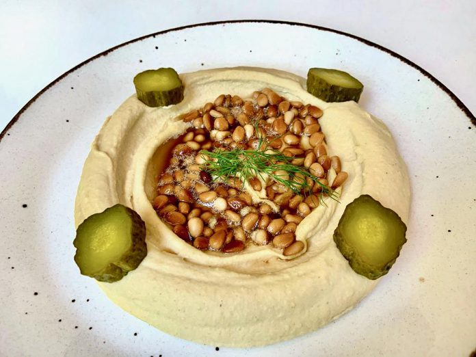 Tuncay Alkan's butter pine nut hummus. While living in Turkey, Tuncay would buy hummus from one of the many places that offered the traditional dish. When he moved to Canada, he wasn't fond of the prepared hummus offered in grocery stores and decided to make his own.  (Photo courtesy of Tuncay Alkan)