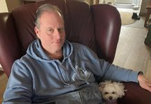 Peter Blodgett, owner of Darling Insurance, with Lexie. Although Blodgett is allergic to all animals, he has donated $100,000 towards the construction of the Peterborough Humane Society's new animal care centre. (Supplied photo)