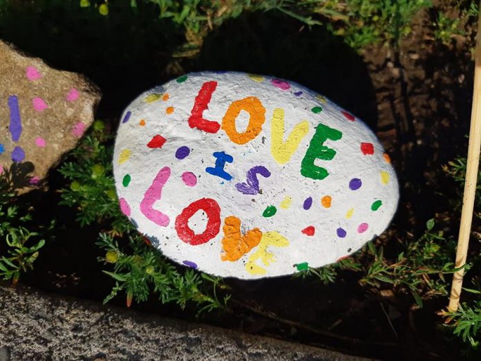 One of the many painted rocks, signs, and flags containing messages for the Peterborough Victoria Northumberland and Clarington Catholic District School Board, following a June 22, 2021 decision by the board not to fly the Pride flag at Catholic schools. (Photo courtesy of Kimberly Liane)