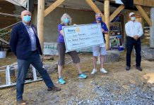Camp Kawartha board chair Myke Healy, Camp Kawartha healthcare coordinator Cathy Romano, Rotary Club of Peterborough president Wayne Harding, and Camp Kawartha executive director Jacob Rodenburg celebrating the Rotary Club's $100,000 donation to the camp's new zero-carbon health centre. In its founding year of 1921, the Rotary Club of Peterborough established the summer camp that would become Camp Kawartha in 1985. (Photo courtesy of Camp Kawartha)