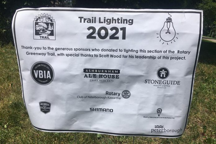 This mock-up of the embossed metal plaque that will recognize sponsors' contributions to the lighting of Rotary Greenway Trail from Hunter Street East to Douro Street was on display at an update on the project held June 22, 2021.  (Photo: Paul Rellinger / kawarthaNOW)