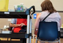 A woman receives her first dose of the Pfizer vaccine at the mass vaccination clinic at the Evinrude Centre in Peterborough on May 26, 2021. (Photo: Bruce Head / kawarthaNOW)