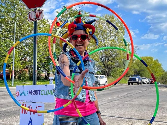 Carolyn Collins spends four hours every week day on the corner of Cherryhill and Brealey in Peterborough spreading smiles as the Walk About Clown. (Photo: Beareh)