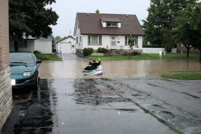 Residents used whatever they had on hand to cross flooded roads. (Photo: City of Peterborough Emergency & Risk Management Division)