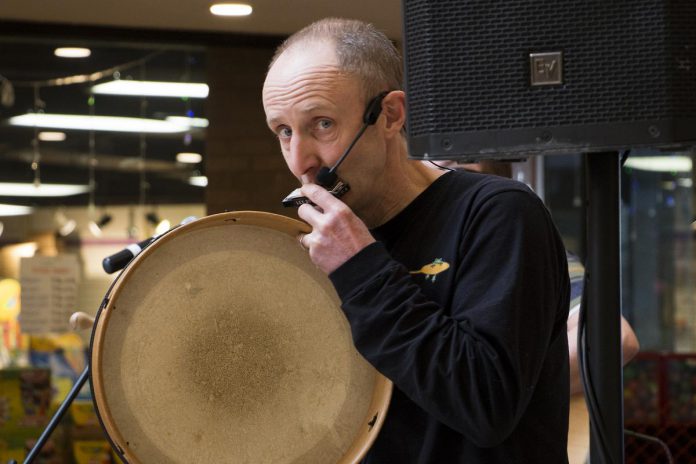 Musician Glen Caradus performed in early 2019 as part of Peterborough Family Literacy Day in Peterborough Square.  On August 7, 2021, the longtime environmental activist will travel 350 kilometers to raise awareness and fund climate-related programs offered by Peterborough GreenUP.  (Photo: Peter Rellinger)