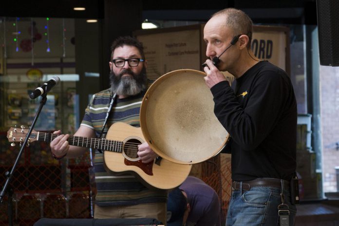 Longtime musical collaborators Phil Stephenson (left) and Glen Caradus presented their popular Paddling Puppeteers show to thousands across the country, including this performance from early 2019 presented as part of the Day of the Family Literacy from Peterborough to Peterborough Square.  (Photo: Peter Rellinger)