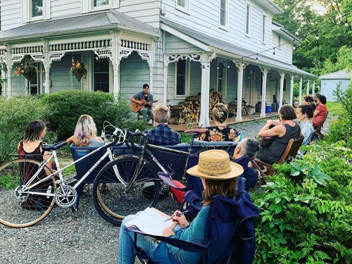 As a pandemic project, Peterborough housemates Tiphaine Lenaik and Rosemary MacAdam launched a series of porch concerts at their Bonaccord Street home last summer. Tiphaine organizes the concerts, while homeowner Rosemary emcees. The series, called 'Waiting for the right porch', is returning this summer with a porch concert every two weeks. Pictured is the July 23, 2021 concert, which featured LA Alfonso, Jake Bartoli, River Jensen, and Kalen Davidson. (Photo courtesy of Tiphaine Lenaik)