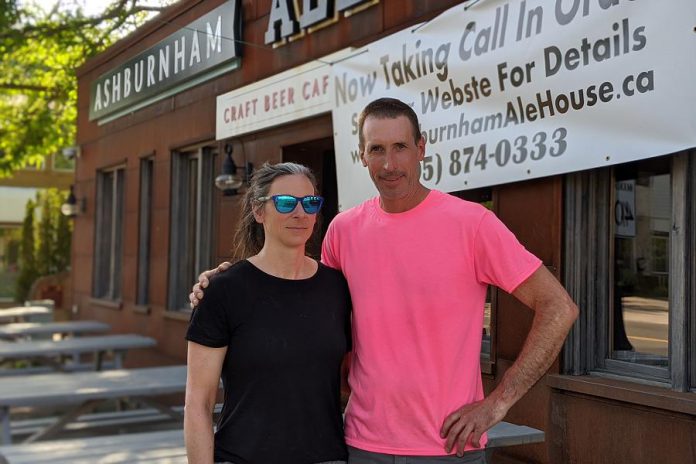 Ashburnham Ale House owners Nollie and Scott Wood, pictured in June 2020 preparing for the reopening of their restaurant's patios during the first pandemic summer. The couple completely renovated the building previously occupied by Fergusons Dry Cleaners and opened the craft beer cafe on June 27, 2013. (Photo: Bruce Head / kawarthaNOW)