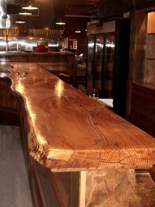 The main bar at Ashburnham Ale House is made of solid oak from Woodview Farm & Forest, just outside of Lindsay. (Photo: Jeannine Taylor / kawarthaNOW)