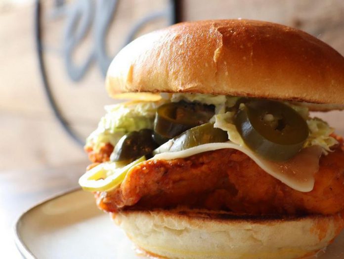 The El's menu is inspired by owners owners Greg and Amanda da Silva's world travels. Featuring locally sourced ingredients, menu items like this fried chicken sandwich, topped with sriracha hot sauce topped, jalapeño jack cheese, jalapeños and creamy slaw, bring new flavours to classic pub food selections. (Photo: The El)