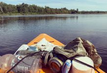 Christine Hoogkamer's kayak loaded with garbage she's collected from the water, as she paddles by the beach at Emily Provincial Park near Omemee. She has an Instagram account called 'Emily Garbage Shark' where she shares photos of the litter she's removed from the environment. (Photo courtesy of Christine Hoogkamer)