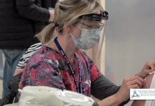 A resident receives a COVID-19 vaccination at the Fenelon Falls immunization clinic. (Screenshot from HKPRKHU video by kawarthaNOW)