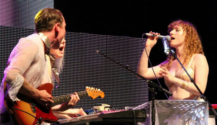 Kelly McMichael performing with her former band Rouge at Pride in Toronto in 2014. The singer-songwriter now lives in St. John's, Newfoundland, but visits her hometown of Peterborough regularly. (Photo: Rouge / Facebook)