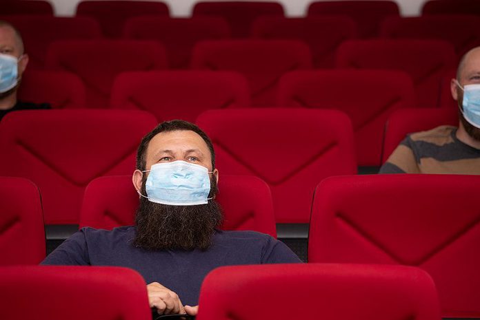 Cinemas, concert, theatres, and other performing arts venues can reopen with capacity limits during step three of Ontario's reopening plan effective July 16, 2021. Face masks are still required in all indoor settings. (Stock photo)