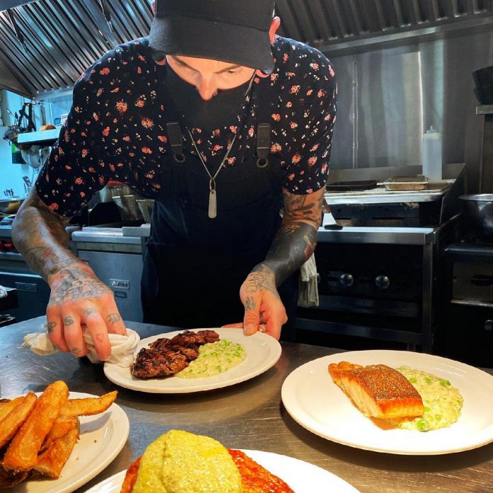 Sous-chef Andrew Orde plates dishes at Rare restaurant in downtown Peterborough. Orde, who previously ran brunch at Electric City Bread Company in Peterborough, also takes the lead on Sunday morning brunch at Rare. (Photo courtesy of Rare)