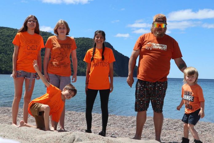 Ashley Wynne (centre) with her family. When the pandemic hit, Wynne began homeschooling three of her four children, incorporating Indigenous language and teachings with the Ontario curriculum. Her experience homeschooling led her to launch an Indigenous culture-based school called Sage and Sunshine to ensure Indigenous children aged four to nine learn about their heritage, culture, and language. (Photo courtesy of Ashley Wynne) 