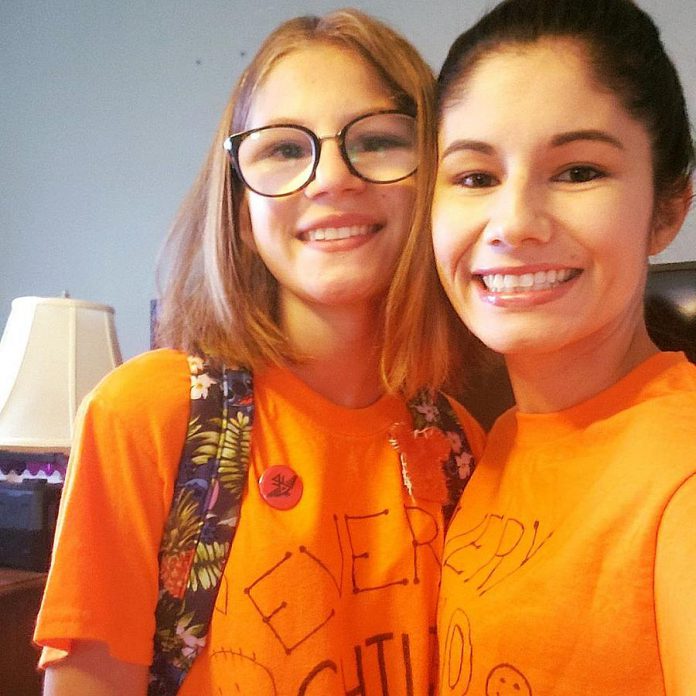 Ashley Wynne and her daughter on Orange Shirt Day, which honours the survivors of Canada's residential school system. Although Wynne had Sage and Sunshine in the works long before the recent discoveries of unmarked graves at former residential schools, Sage and Sunshine comes at a crucial moment for Canada. Wynne says schools like Sage and Sunshine will begin to redress the harm done by the residential school system, which was created for the purpose of stripping Indigenous people of their language and culture. (Photo courtesy of Ashley Wynne)  