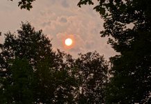 The late afternoon sun appears pinkish orange on July 19, 2021 due to smoke from active forest fires in northwestern Ontario moving over southern Ontario. (Photo: Bruce Head / kawarthaNOW)