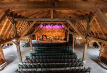 Westben's 'Welcome Back Weekend' starting July 30th will feature concerts on Friday and Saturday night at the new Willow Hill outdoor venue, followed by a concert on Sunday afternoon at Westben's primary performance venue The Barn (pictured). To accommodate pandemic protocols, seating will be limited to 100 people in physically distanced groups. The Barn's massive walls and doors will be rolled away, serving the dual purpose of providing open-air ventilation and allowing guests to experience music and nature at once. (Photo: Wayne Eardley, courtesy of Northumberland County)