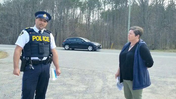 North Kawartha Mayor Carolyn Amyotte speaks with Peterborough County OPP staff sergeant Chris Galeazza in May 2021 about the three stretches of Highway 28 in North Kawartha that have the most collisions, the reasons why, and the intention to have the three stretches designated as community safety zones where speeding fines are doubled. (kawarthaNOW screenshot of Facebook video)