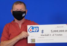 Marshall Dominey with his $5 million Lotto 6/49 prize. (Photo supplied by OLG)