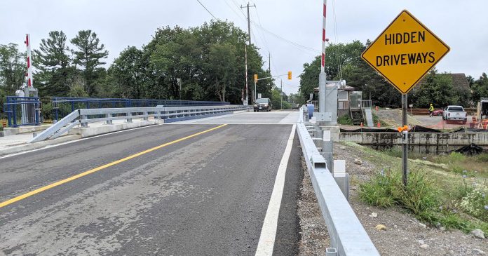 After being closed since October 2020 and several construction-related delays, the Warsaw Road Swing Bridge on Parkhill Road in Peterborough reopened for vehicle and pedestrian traffic on August 14, 2021. (Photo: Bruce Head / kawarthaNOW)