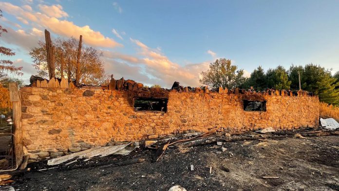 The fieldstone foundation is all that remains of the Alton family's historic 240-year-old barn after it was struck by lightning on August 29, 2021. The Alton's daughter has launched a GoFundMe campaign to help her parents with immediate costs from the devastating fire and to replace uninsured equipment. (Photo courtesy of Tiffany Alton-Froggatt)