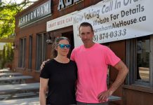 Ashburnham Ale House owners Nollie and Scott Wood, pictured in June 2020 preparing for the reopening of their restaurant's patios during the first pandemic summer. According to Scott, while the proof of vaccination requirement is "a pain", almost all of his customers have been fine with it. (Photo: Bruce Head / kawarthaNOW)